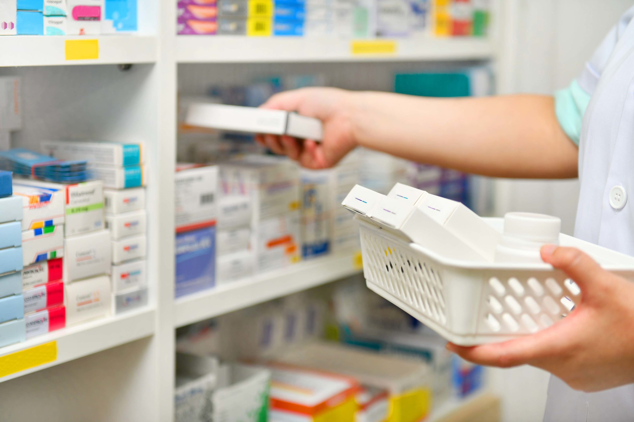 pharmacist restocking medication